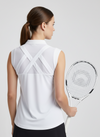 Susanna Polo by Ashley Herrera — performance-driven white sleeveless activewear polo featuring criss cross detailed giving and elavted look on the course or court.