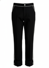 Mila Pants — premium women’s golf and activewear trousers in black with white piping, perfect for both golfing and office wear.