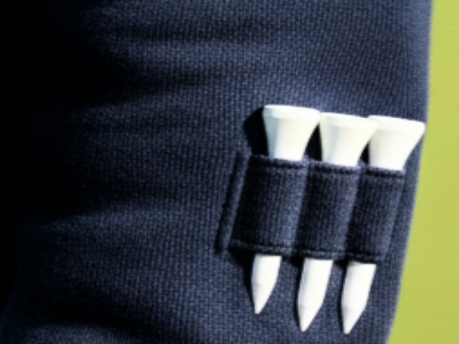 Luxury women’s golf apparel pullover in Navy and white with 3 tee holder on sleeve. 