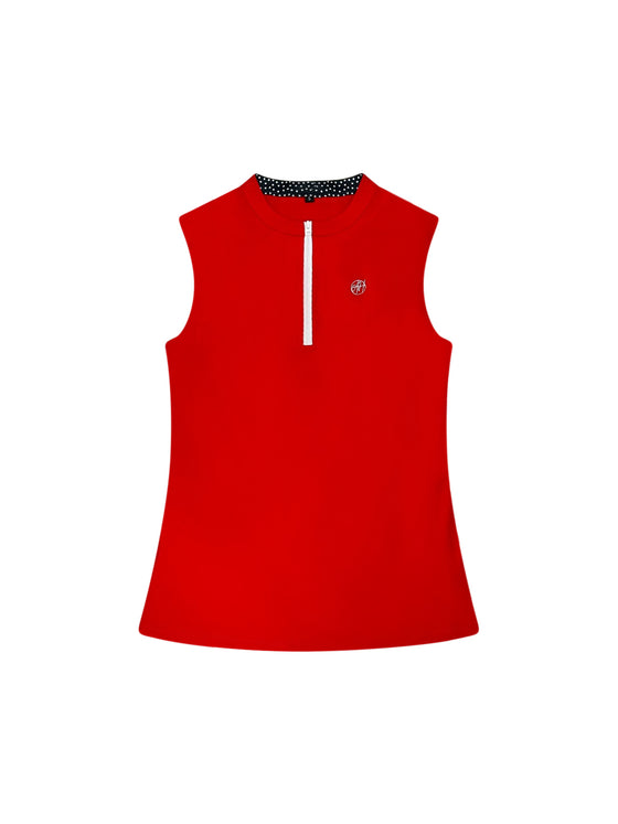 Ashley Herrera Susanna Polo — women’s luxury sleeveless golf and tennis polo in bold red with white zipper and black-and-white polka dot collar detail.