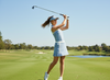 
Model wearing Vanessa Skort in Cloud Blue — elegant, high-performance golf and tennis skort with micro pleats, back pockets, and 3-tee holder for on-course convenience.
Detail view of Vanessa Polo — luxury sleeveless golf polo in Cloud Blue with contrast under-collar fabric, silver buttons, and vented back panel for performance and style