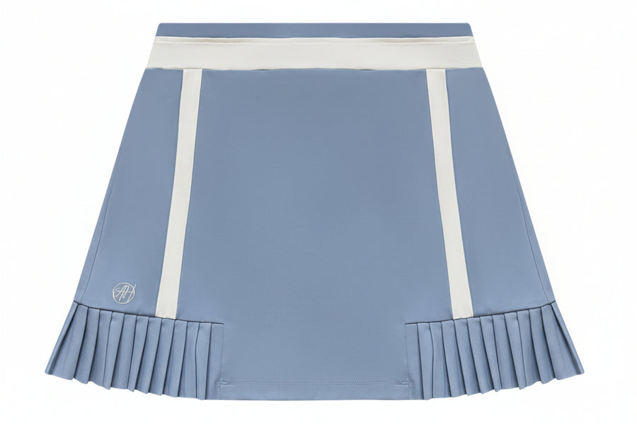 Vanessa Skort in Cloud Blue — women’s luxury golf and activewear skort featuring elegant piping, micro pleats, and functional details like a 3-tee holder and back pockets.