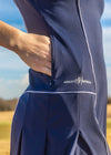 Women’s Navy & White Stripe Active Dress — luxury performance dress for golf, tennis, and pickleball with a flattering modern fit and comfortable movement. Hidden side pockets. Detailed piping. 
