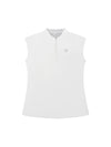 Women’s Susanna sleeveless polo in white with silver zipper and polka dot mock collar detail.