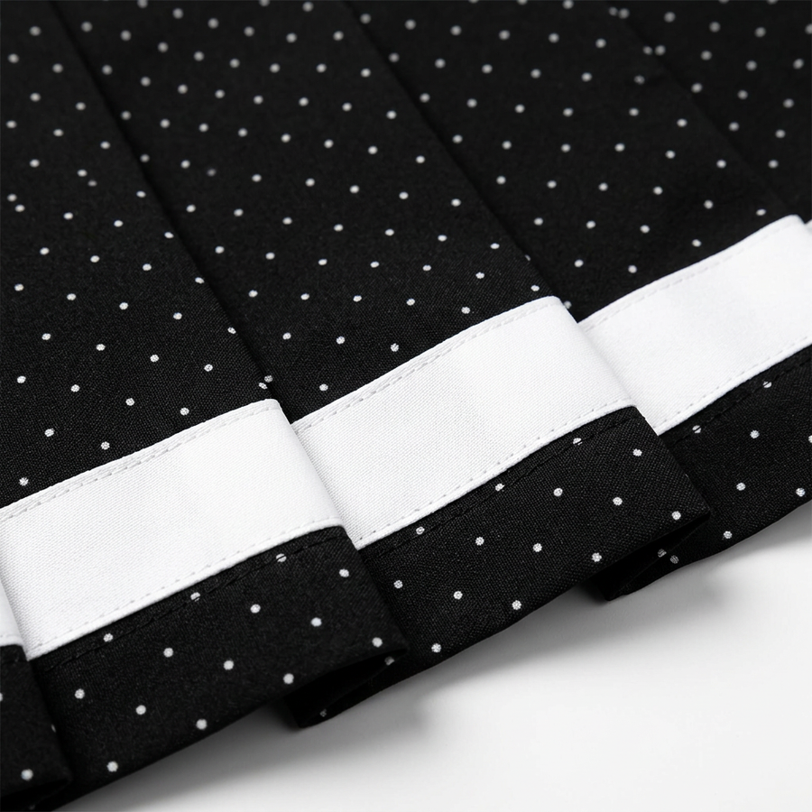 Renée black micro polka-dot skort ribbon and pleat detail
